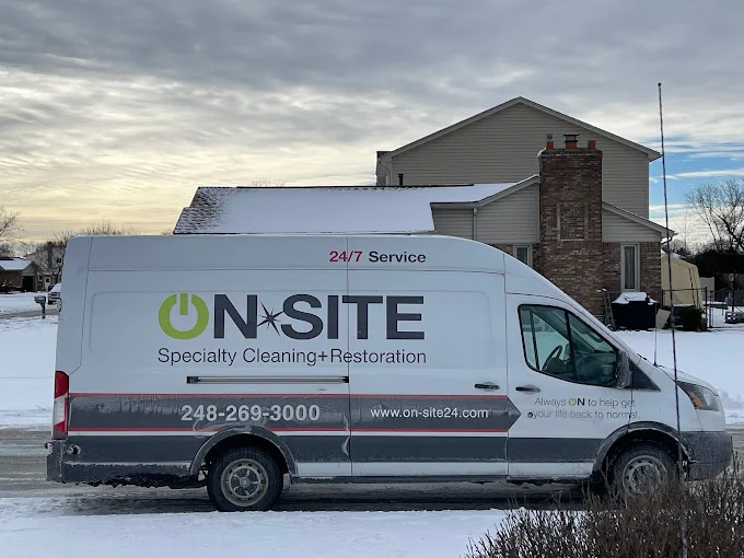 On-Site Restoration company van parked outside of residential home