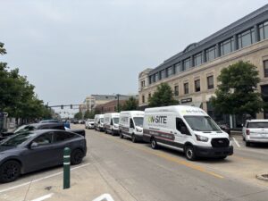 row of on-site vans in the street