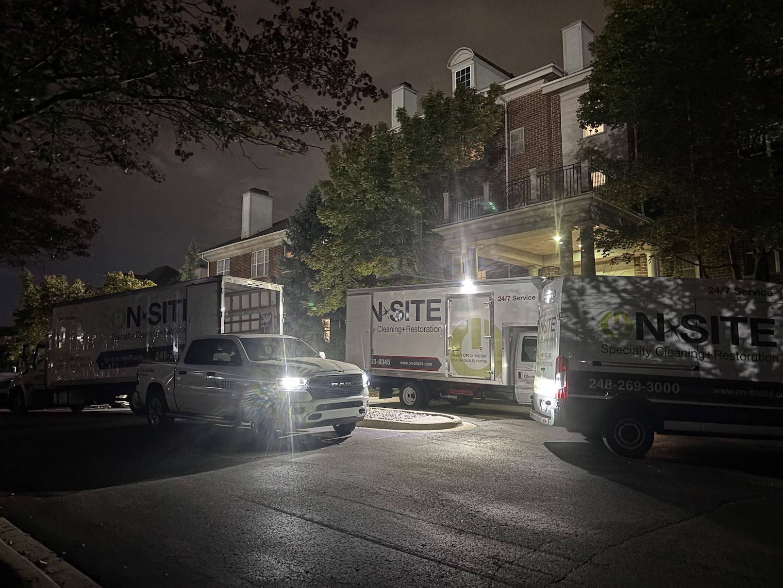 apartment building with on-site vans in the front