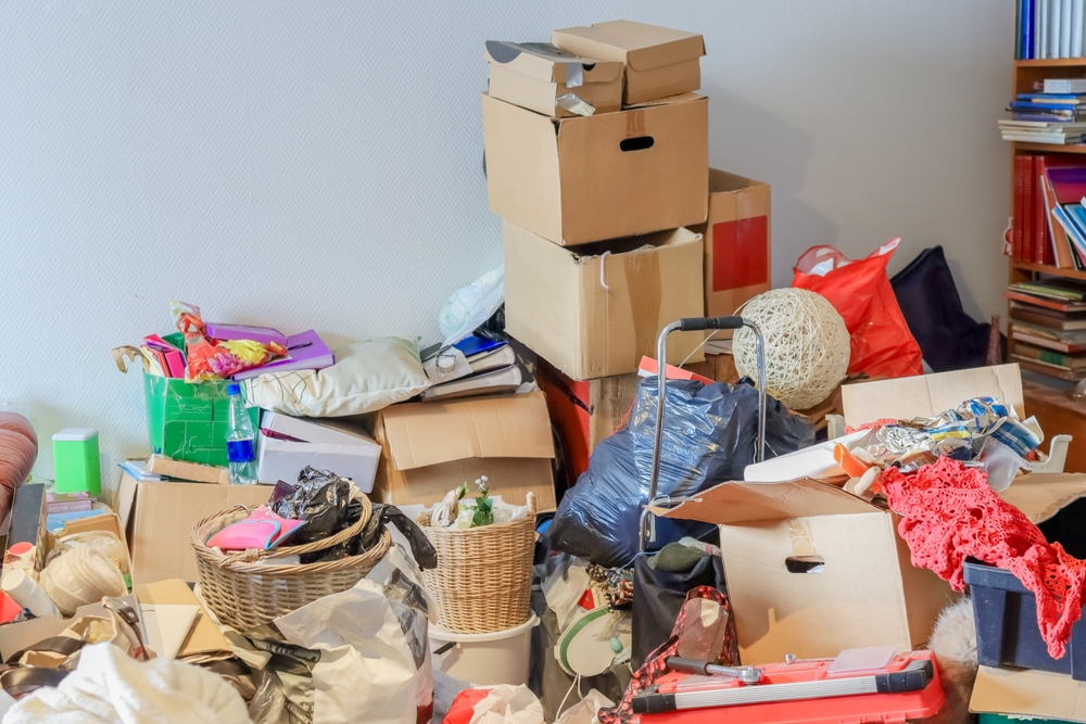 a room of a person experiencing hoarding issues, piled high with items