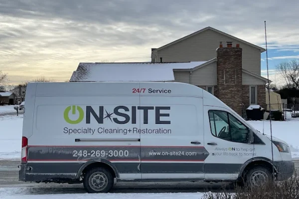 On-Site Restoration company van parked outside of residential home